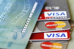 West Palm Beach, USA - May 19, 2015: Partial view of major credit cards: VISA, Master Card, and American Express. Extreme closeup with selective focus and very narrow depth of field.